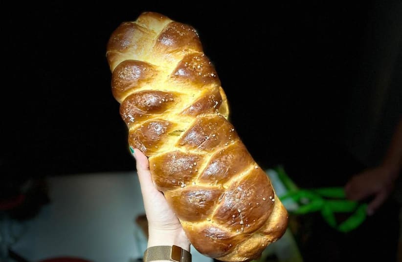 A fresh challah comes out of the oven (Illustrative) (photo credit: Courtesy)