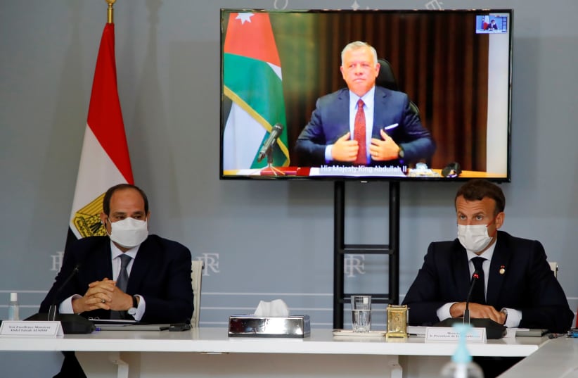 FRENCH PRESIDENT Emmanuel Macron (right) and Egyptian President Abdel Fattah al-Sisi attend a videoconference with Jordan’s King Abdullah (on screen), at the Élysée Palace in Paris earlier this week. (photo credit: REUTERS)