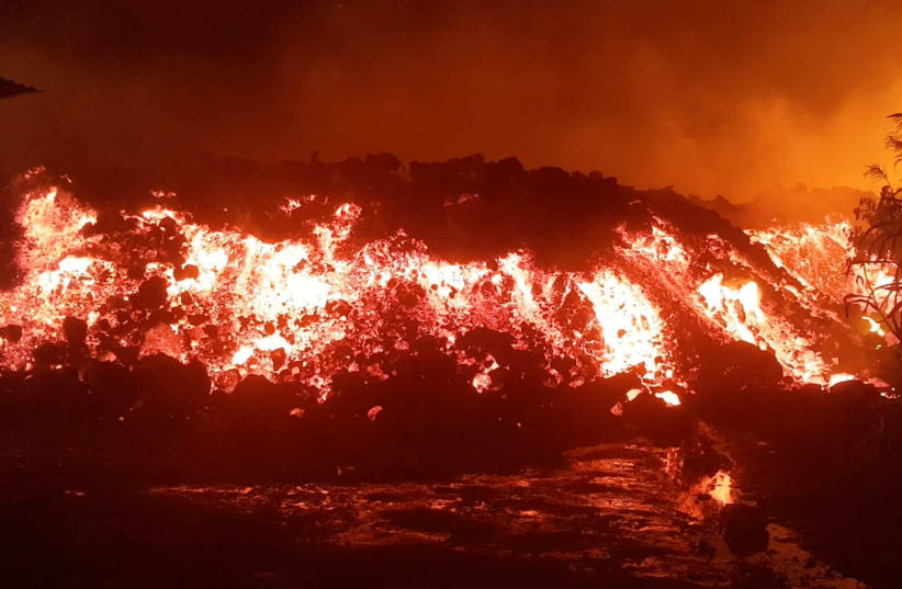 Flowing lava from the volcanic eruption of Mount Nyiragongo, is seen in Goma (photo credit: REUTERS)