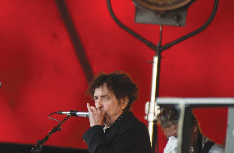 BOB DYLAN performs at the Roskilde Festival 2019 in Denmark. (photo credit: HELLE ARENSBAK/RITZAU SCANPIX/REUTERS)