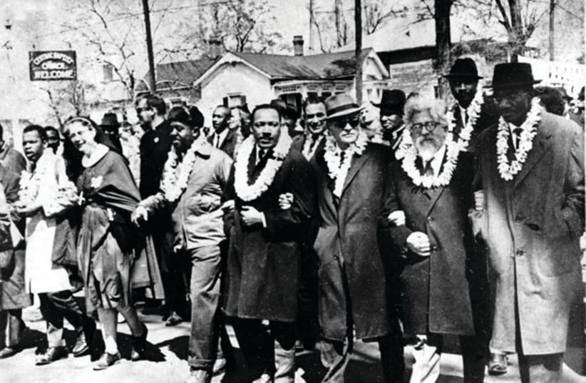 Rabbi Abraham Joshua Heschel (second from right) marching with Martin Luther King Jr. from Selma to Montgomery in 1965 (photo credit: WIKIPEDIA)