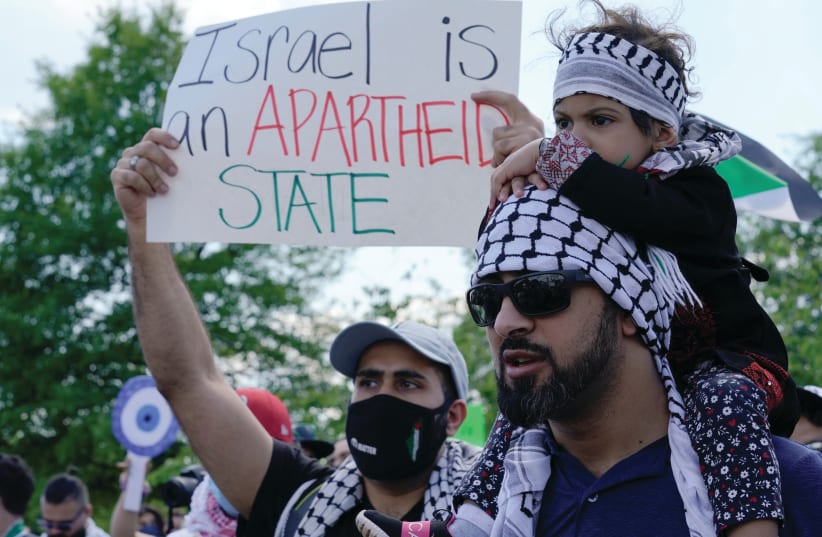 PRO-PALESTINIAN demonstrators protest against during a rally at the Washington Monument last week. (photo credit: YURI GRIPAS/REUTERS)