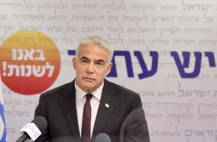 Yesh Atid leader Yair Lapid address his party's faction meeting at the Knesset, May 24, 2021 (photo credit: MARC ISRAEL SELLEM/THE JERUSALEM POST)