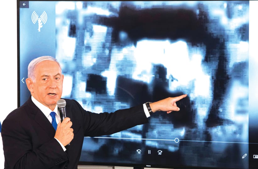 PRIME MINISTER Benjamin Netanyahu briefs ambassadors to Israel at a military base in Tel Aviv last week. (photo credit: SEBASTIAN SCHEINER/POOL VIA REUTERS)