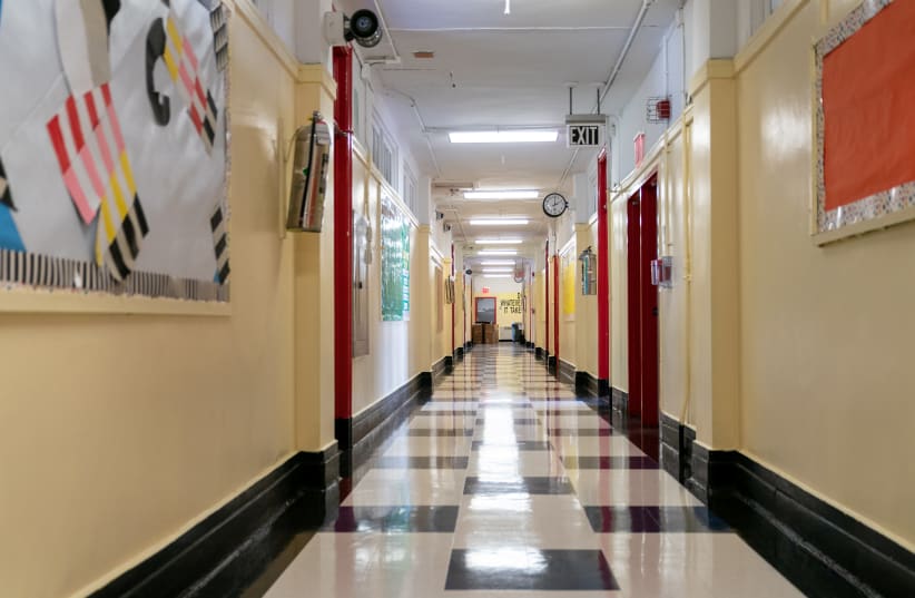 A hallway stands empty during a news conference at New Bridges Elementary School, ahead of schools reopening, in the Brooklyn borough of New York City, amid the coronavirus disease (COVID-19) outbreak in New York, US, August 19, 2020.  (photo credit: JEENAH MOON/POOL VIA REUTERS)