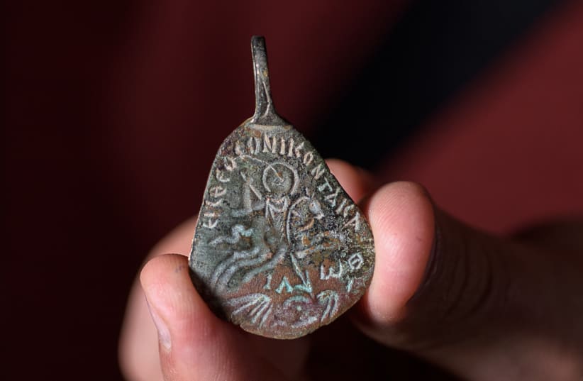 Ancient amulet to protect against the 'evil eye.' (photo credit: DAFNA GAZIT/ISRAEL ANTIQUITIES AUTHORITY)