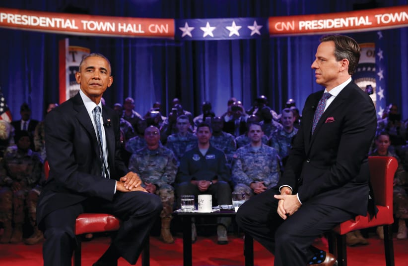 CNN’S JAKE TAPPER with president Barack Obama at a town hall meeting in Fort Lee, Virginia, 2016. (photo credit: KEVIN LAMARQUE/REUTERS)