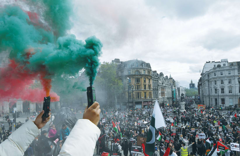 Pro-Palestinian demonstrators rally in London on May 22. (photo credit: TOBY MELVILLE/REUTERS)