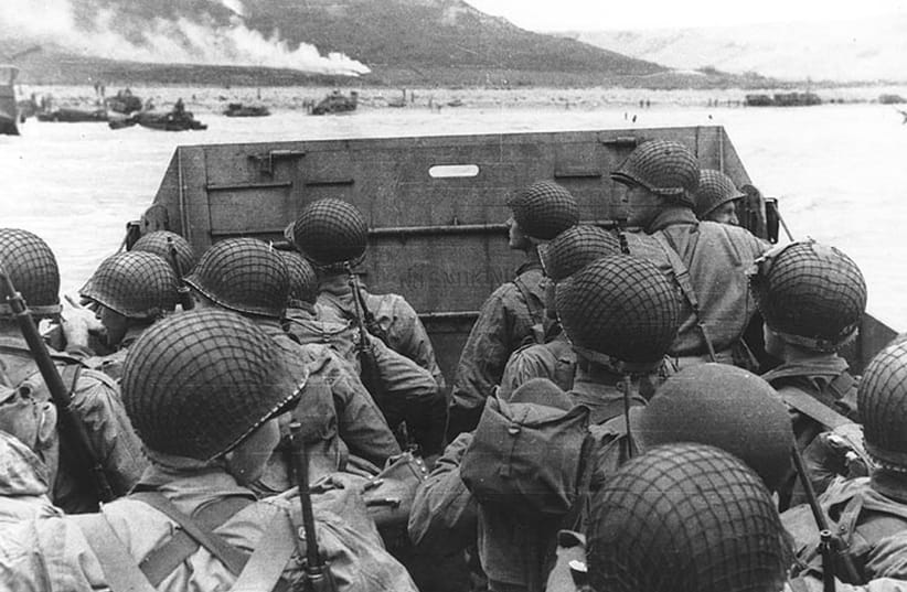 Troops in an LCVP landing craft approach Omaha Beach on D-Day, June 6, 1944 (photo credit: DVIDSHUB/FLICKR)