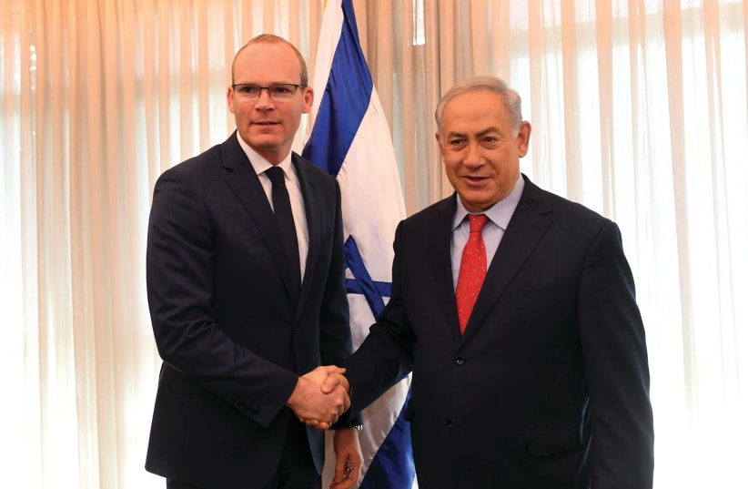 PRIME MINISTER Benjamin Netanyahu meets with Irish Foreign Minister Simon Coveney in 2018. (photo credit: HAIM ZACH/GPO)
