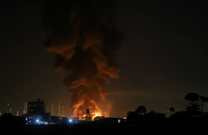 Smoke rises at an oil refinery in Tehran. (photo credit: REUTERS)