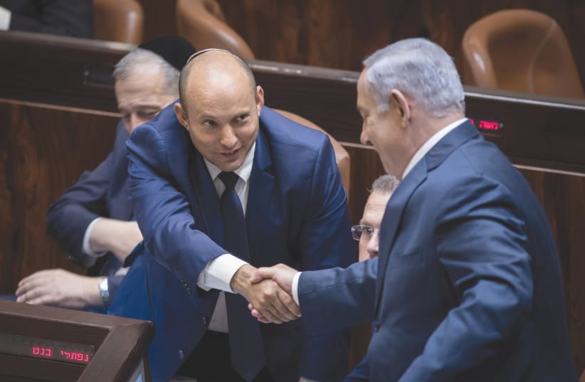 PRIME MINISTER Benjamin Netanyahu and then-education minister Naftali Bennett in the Knesset in 2017. (photo credit: HADAS PARUSH/FLASH90)