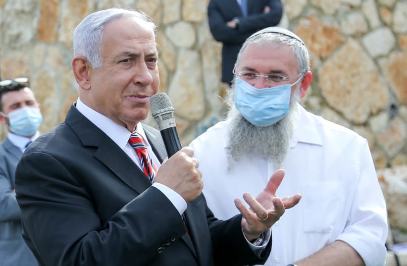 Prime Minister Benjamin Netanyahu attending a ceremony for a new neighborhood in Kfar Etzion, Gush Etzion, March 14, 2021.  (photo credit: GERSHON ELINSON/FLASH90)