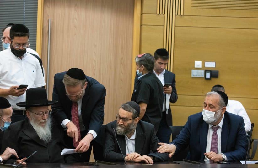 UTJ MK Yaakov Litzman together with UTJ MK Moshe Gafni and Shas head Aryeh Deri gives during a press statement at the Knesset, the Israeli parliament in Jerusalem, June 8, 2021.  (photo credit: YONATAN SINDEL/FLASH 90)