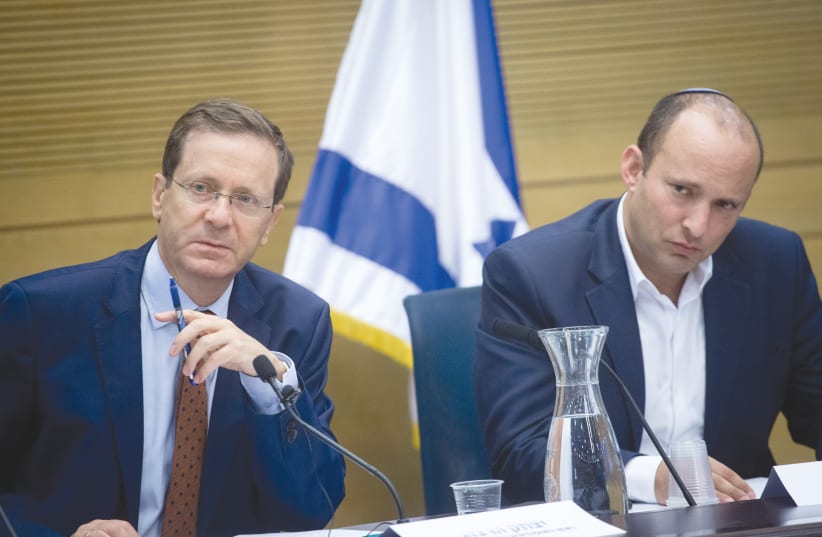 AMID MOUNTING policy headaches, Prime Minister-elect Bennett and President-elect Herzog must heal the country and reaffirm faith in democracy. (photo credit: MIRIAM ALSTER/FLASH90)