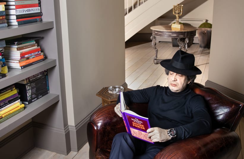 Eduard Shyfrin reading a book at his home (photo credit: Courtesy)