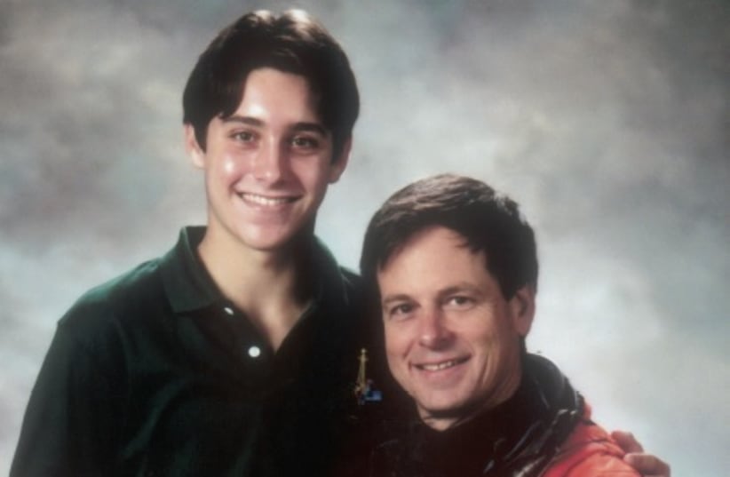 saf and Ilan Ramon holding an astronaut’s helmet in a photo taken at NASA (photo credit: Courtesy)