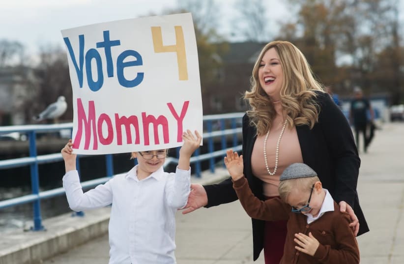 Amber Adler, a single mother of two, is seen with her sons campaigning for her run for NYC city council (photo credit: ANNA RATHKOPF)