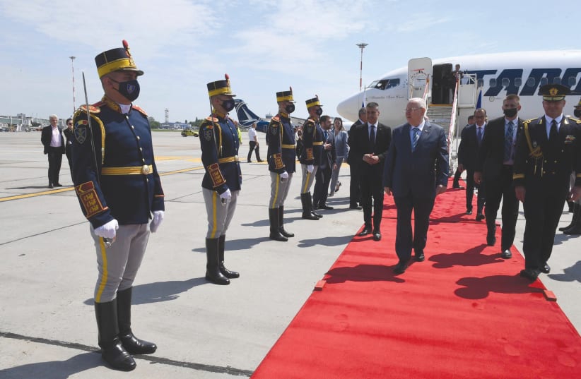 PRESIDENT REUVEN RIVLIN is received by a Romanian honor guard. (photo credit: MARK NEYMAN/GPO)