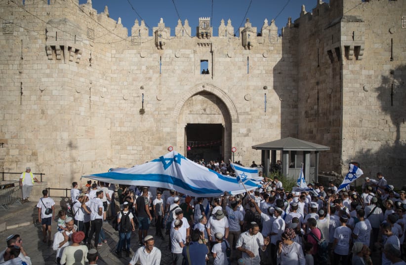 Young Jewish men celebrate Jerusalem day at the Muslim Quarter in the Old City of Jerusalem, June 2, 2019. (photo credit: HADAS PARUSH/FLASH90)