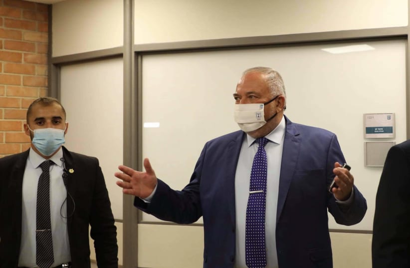 AVIGDOR LIBERMAN arrives at the Knesset ahead of the vote and swearing in of the 36th government, June 13, 2021. (photo credit: MARC ISRAEL SELLEM/THE JERUSALEM POST)