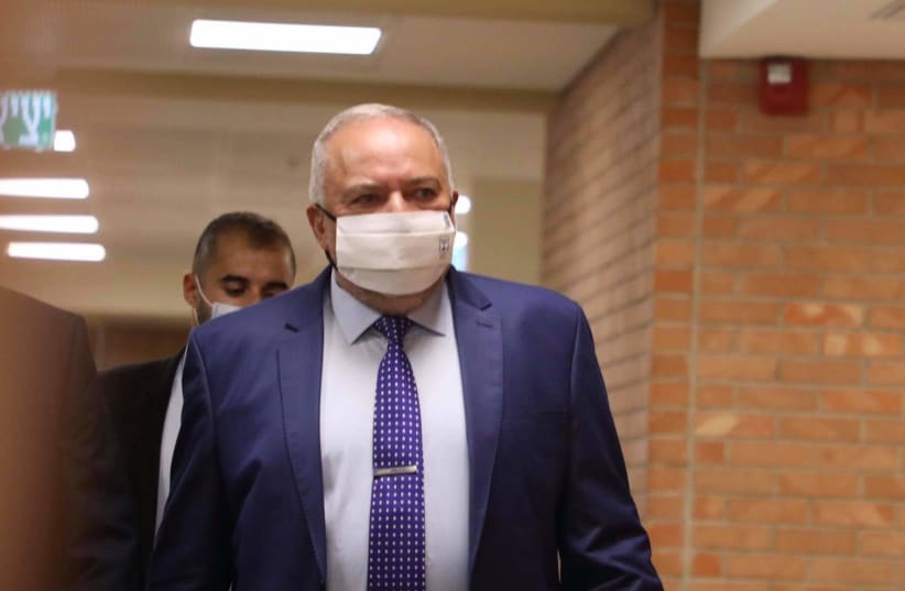 AVIGDOR LIBERMAN arrives at the Knesset ahead of the vote and swearing in of the 36th government, June 13, 2021. (photo credit: MARC ISRAEL SELLEM/THE JERUSALEM POST)