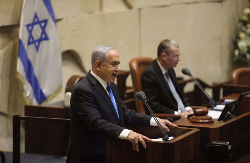 Prime Minister Benjamin Netanyahu addresses Knesset plenum ahead of the new government's swearing in.  (photo credit: MARC ISRAEL SELLEM)