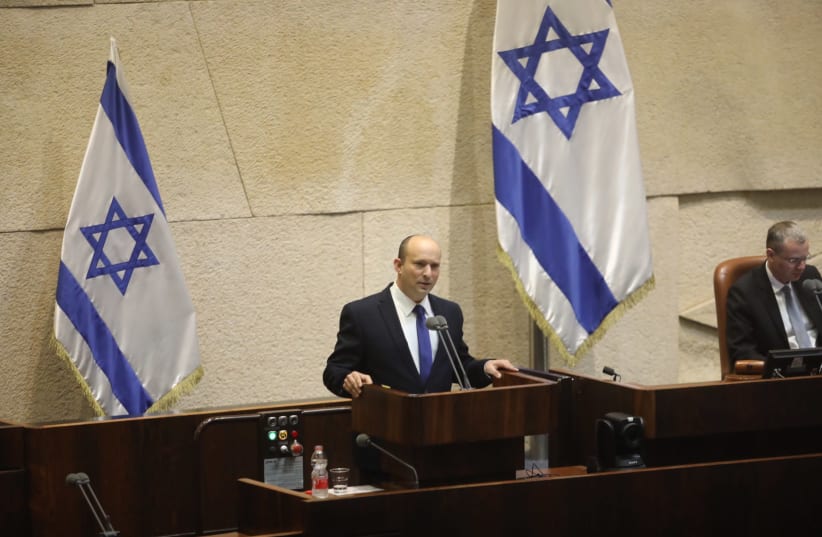 Incoming prime minister Naftali Bennett addresses Knesset plenum on June, 13 2021. (photo credit: MARC ISRAEL SELLEM)