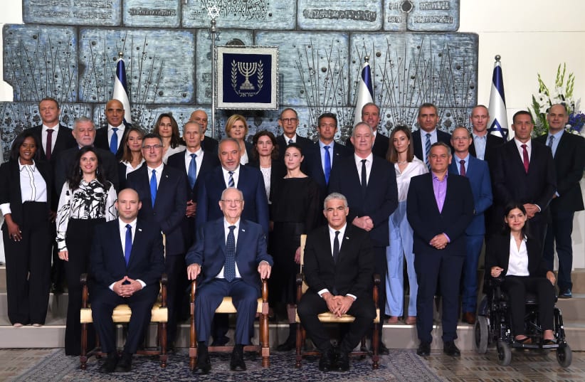 Israel's new government at the President's Residence in Jerusalem on June 14, 2021. (photo credit: AVI OHAYON - GPO)