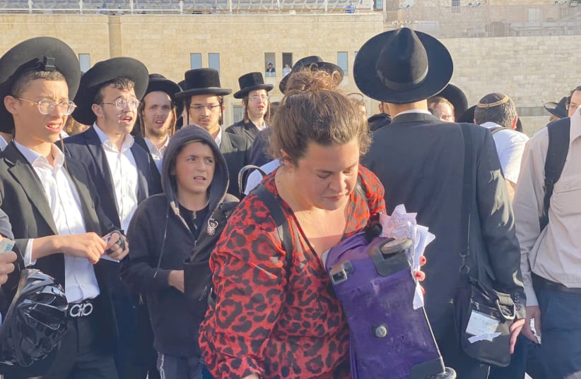 39 SIDDURIM were torn this past Friday morning at the Kotel by ultra-Orthodox men and children. (photo credit: IRENA LOTT/COURTESY OF WOMEN OF THE WALL)