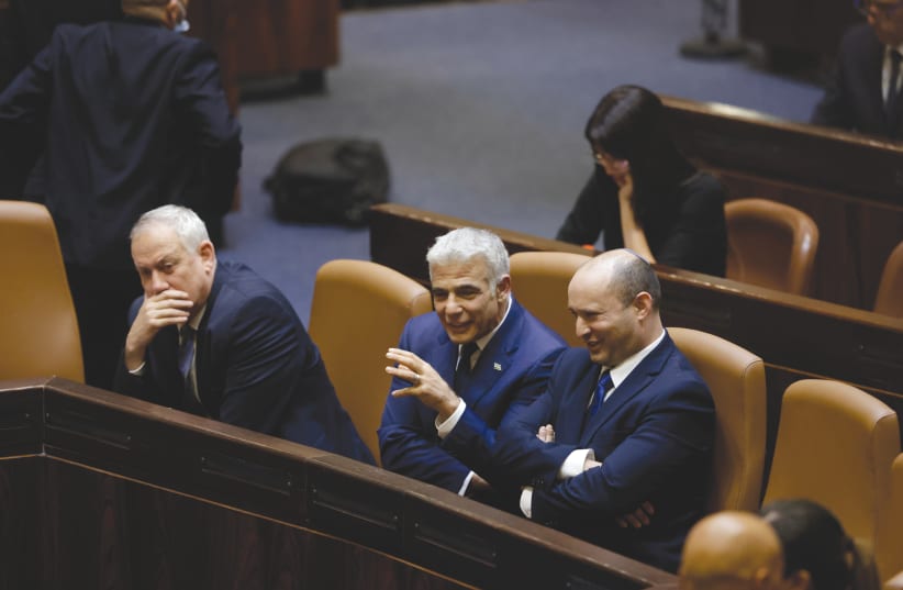 PRIME MINISTER Naftali Bennett with Foreign Minister Yair Lapid and Defense Minister Benny Gantz in the Knesset Sunday. (photo credit: OLIVIER FITOUSSI/FLASH90)