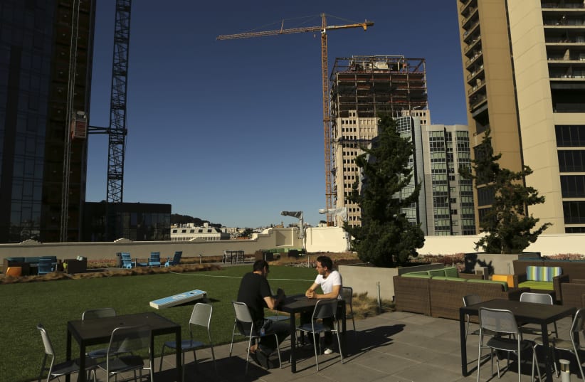 Employees dine on the roof of Twitter headquarters in San Francisco, California October 4, 2013 (photo credit: REUTERS/ROBERT GALBRAITH)
