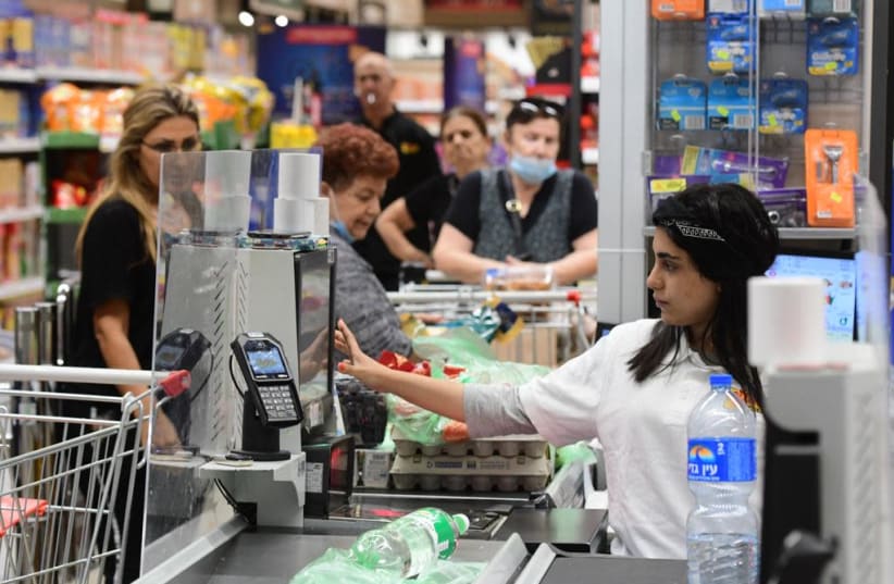 Supermarket shoppers and workers without masks in Tel Aviv. (photo credit: AVSHALOM SASSONI) (photo credit: AVSHALOM SASSONI)