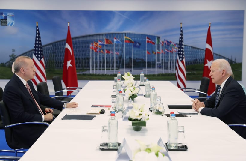 Turkish President Tayyip Erdogan and U.S. President Joe Biden attend a bilateral meeting on the sidelines of the NATO summit in Brussels, Belgium June 14, 2021. Murat Cetinmuhurdar/Presidential Press Office/Handout (photo credit: MURAT CETINMUHURDAR/PRESIDENTIAL PRESS OFFICE/HANDOUT VIA REUTERS)