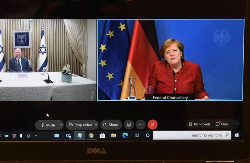 President Reuven Rivlin's parting conversation with German Chancellor Angela Merkel. (photo credit: MARK NEYMAN/GPO)