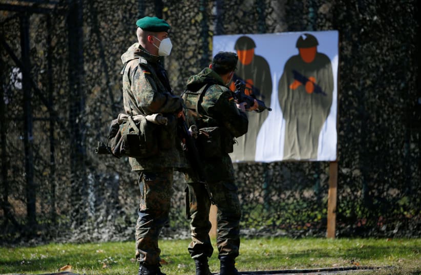Soldiers of the German armed forces Bundeswehr train for "Voluntary military service in homeland security" in Berlin, Germany, April 27, 2021 (photo credit: REUTERS/MICHELE TANTUSSI)