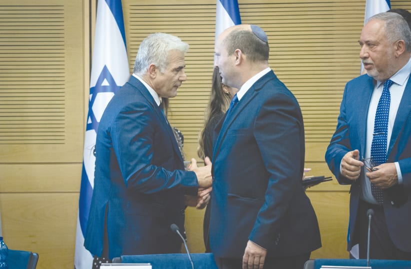 FROM LEFT: Foreign Minister Yair Lapid, Prime Minister Naftali Bennett and Finance Minister Avigdor Liberman attend the new government’s first meeting, at the Knesset on Sunday. (photo credit: YONATAN SINDEL/FLASH90)