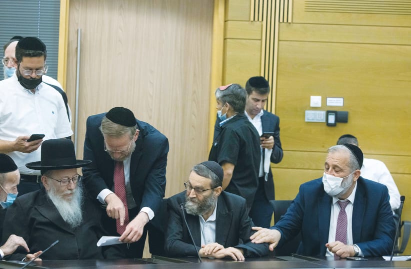 UNITED TORAH JUDAISM Party MK Ya’acov Litzman (left), UTJ MK Moshe Gafni and Shas head Arye Deri converse during a meeting at the Knesset earlier this month.  (photo credit: YONATAN SINDEL/FLASH90)