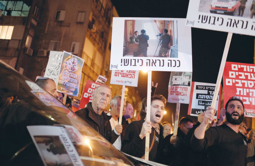 DEMONSTRATORS PROTEST against Israeli ‘occupation’ and violence between Jews and Arabs, at a rally in Tel Aviv (photo credit: TOMER NEUBERG/FLASH90)