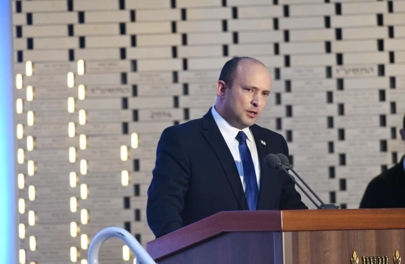 PM Naftali Bennett giving a speech (photo credit: AMOS BEN-GERSHOM/GPO)