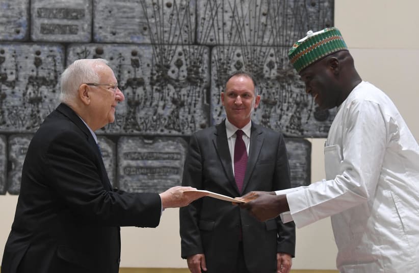 Rivlin receives credentials from Nigerian Ambassador Nart Augustine Kolo after being introduced by Cheif of State Propotocol Gil Haskel (photo credit: MARK NEYMAN / GPO)