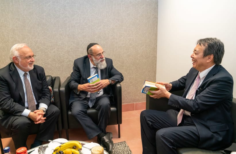 Japanese Ambassador to Israel Koichi Mizushima and Rabbi Abraham Cooper Associate Dean of the Simon Wiesenthal Center meeting with Rabbi Kalman Samuels (photo credit: SHALVA)