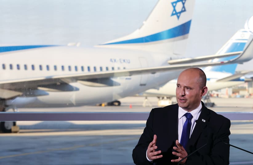 PRIME MINISTER Naftali Bennett delivers a statement after his tour of Ben-Gurion Airport this week amid a rise in cases of COVID-19. (photo credit: RONEN ZVULUN/REUTERS)