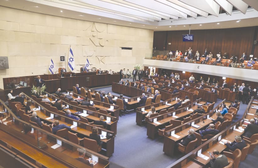 ONE MAJOR DIFFERENCE between Israel’s electoral system and that of most other Western democracies is the lack of any direct connection between the people who gain a seat in the Knesset and ordinary Israeli voters.  (photo credit: ALEX KOLOMOISKY / POOL)