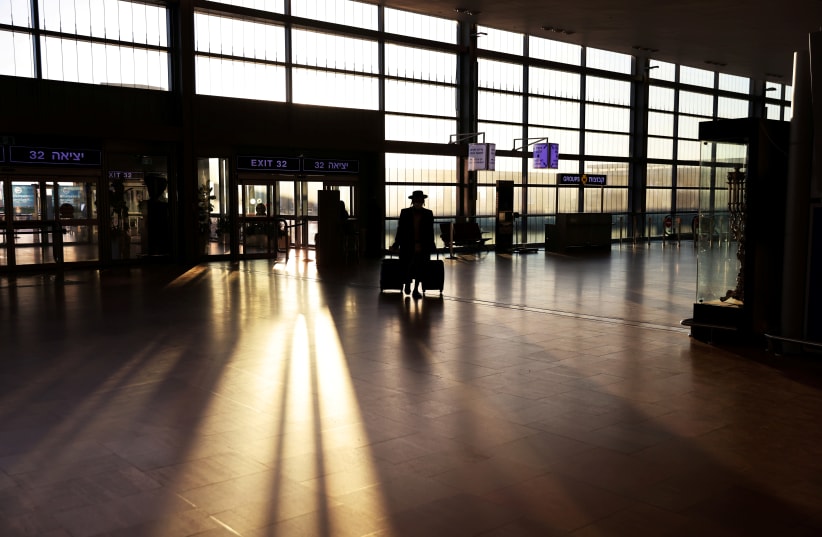 A passenger at Ben Gurion Airport  (photo credit: RONEN ZVULUN/ REURERS)