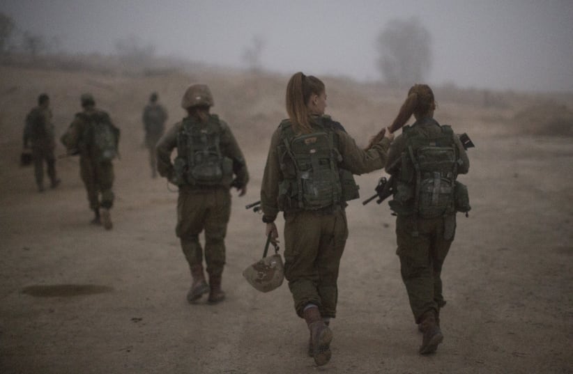 Female soldiers of the Bardales Battalion preparing for urban warfare training, near Nitzanim in the Arava area of Southern Israel.  (photo credit: HADAS PARUSH/FLASH90)