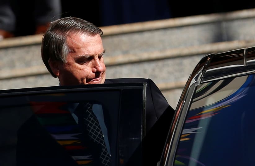 Brazil's President Jair Bolsonaro gets in a vehicle after attending Mass at a Catholic church in Brasilia, Brazil July 1, 2021. (photo credit: ADRIANO MACHADO/ REUTERS)