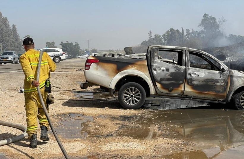 Firefighters work to put out a brushfire near Gan Hashlosha National Park, July 3, 2021. (photo credit: ISRAEL FIRE AND RESCUE AUTHORITY SPOKESMAN)