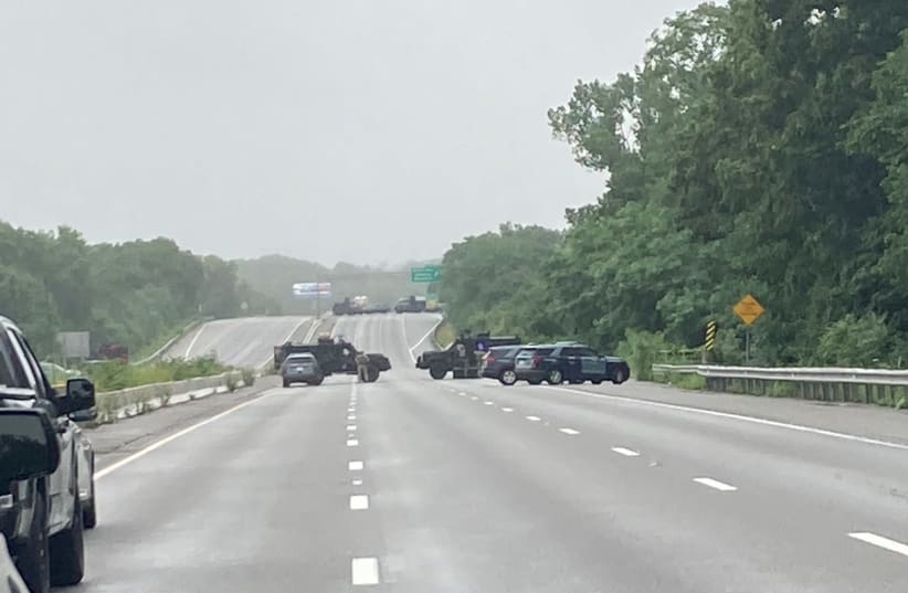 Massachusetts State Police vehicles block Route 95 after an armed standoff between 8 to 10 militia members and police forced the closure of the U.S. interstate highway, in Wakefield, Massachusetts, U.S. July 3, 2021. (photo credit: MASSACHUSETTS STATE POLICE/HANDOUT VIA REUTERS.)