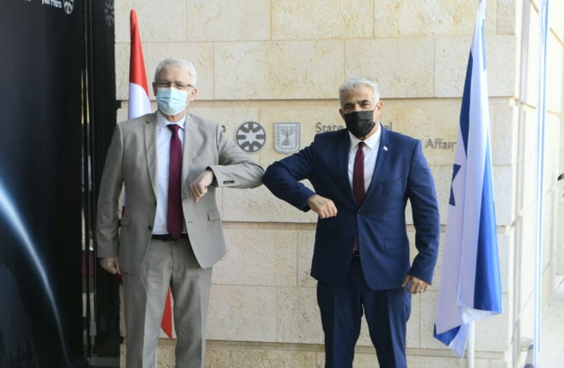 Foreign Minister Yair Lapid meets his Canadian counterpart Marc Garneau in Jerusalem, Sunday, July 4, 2021. (photo credit: AVI HAYUN)